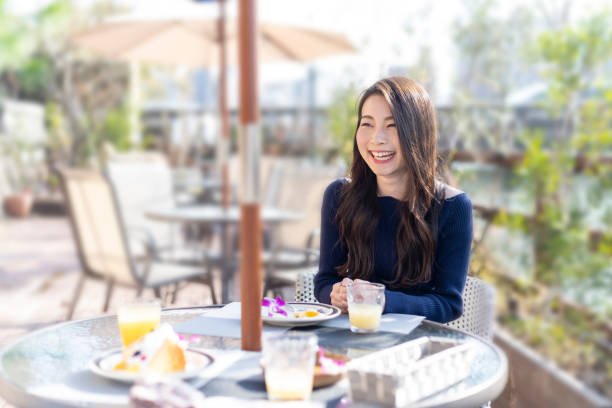 istock Woman Spending Holiday At Cafe On Open Terrace 1138085990