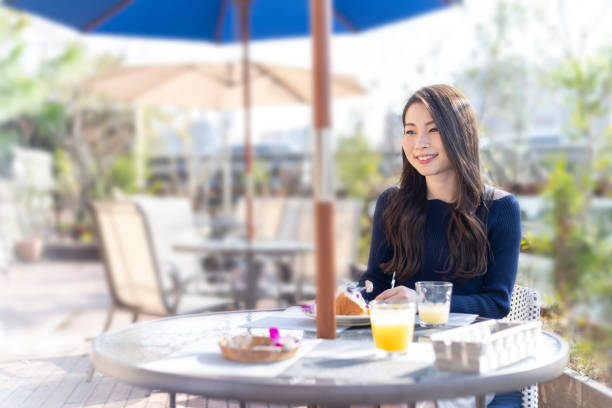 istock Woman Spending Holiday At Cafe On Open Terrace 1138086007