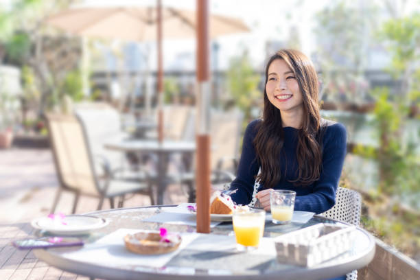 istock Woman Spending Holiday At Cafe On Open Terrace 1138086008