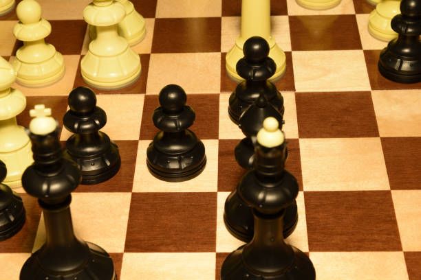 istock Wooden chessboard with white chessmen for hobby background 1138087784