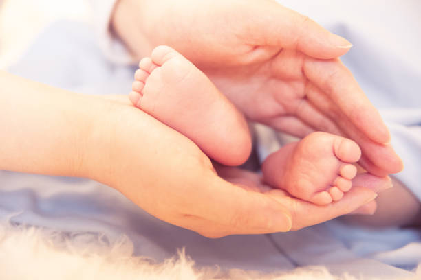 istock Newborn baby feet 1138091357
