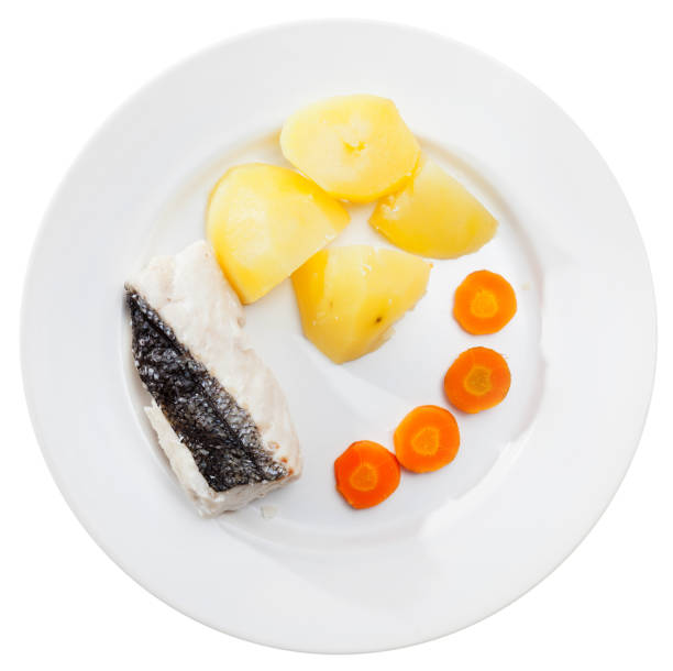 istock Pollock prepared on steam, served with boiled potatoes and carrots 1138092518