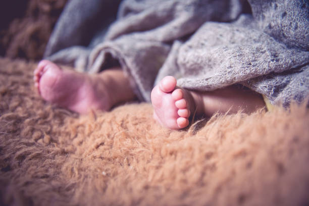 istock Tiny foot of newborn baby 1138093892