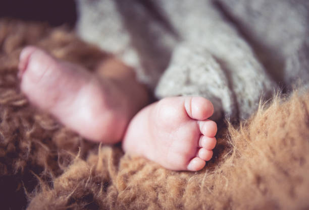 istock Newborn baby foot 1138094704