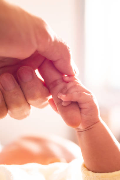 istock Newborn baby holding mother's hand 1138094886