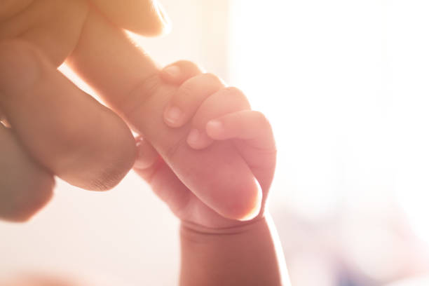istock Newborn baby holding mother's hand 1138094904