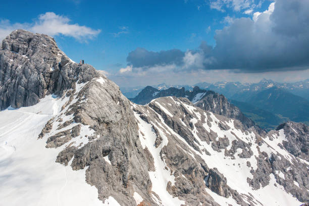 istock On peak of Dachstein and view alpine mountains 1138094973