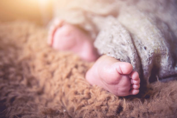 istock Tiny foot of newborn baby 1138095307
