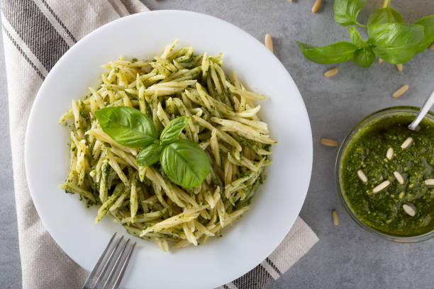 istock Traditional trofie pasta with pesto sauce on white plate 1138098323