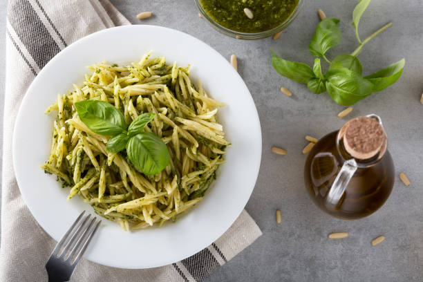 istock Traditional trofie pasta with pesto sauce on white plate 1138098938