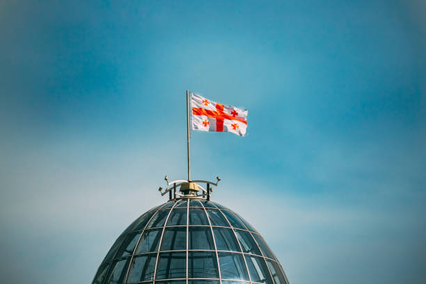 Tbilisi, Georgia. Flag Of Georgia, Five Cross Flag, Waving On Flagpole On Presidential Administration Palace, Avlabari Residence Roof. Close Up Tbilisi, Georgia. Flag Of Georgia, Five Cross Flag, Waving On Flagpole On Presidential Administration Palace, Avlabari Residence Roof. Close Up. georgia flag country stock pictures, royalty-free photos & images