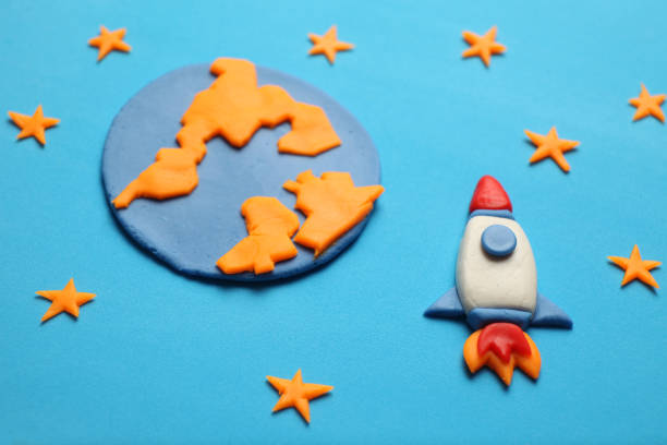 istock Rocket in space, star, planet earth. Plasticine art, cartoon 1138102201