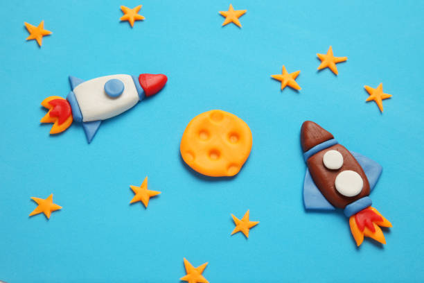 istock Creative craft plasticine rocket in open space, astronaut dreams. Stars, moon. Cartoon art 1138102205