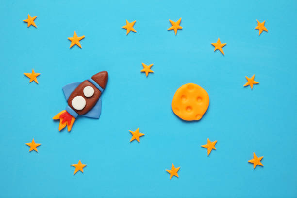 istock Creative craft plasticine rocket in open space, astronaut dreams. Stars, and moon. Cartoon art 1138102210