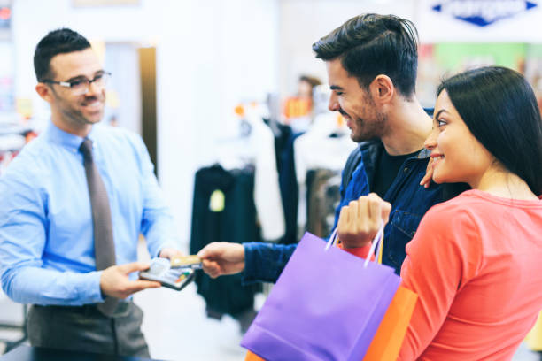 istock Couple Purchasing Clothing 1138102491