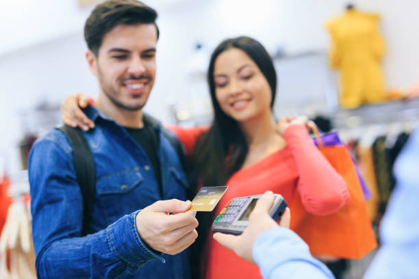istock Couple Purchasing Clothing 1138102492