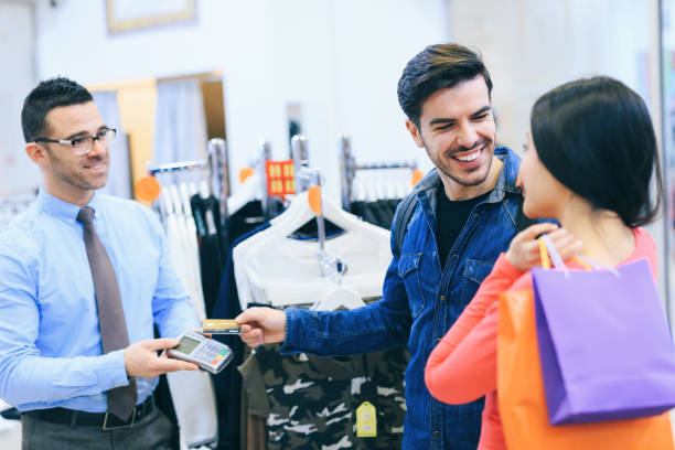 istock Couple Purchasing Clothing 1138102494