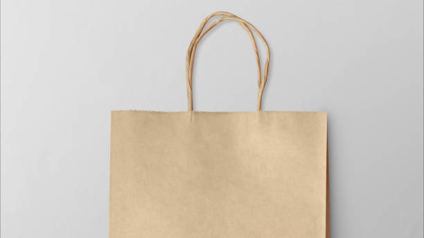 istock Paper shopping bag isolated on grey background 1138102545