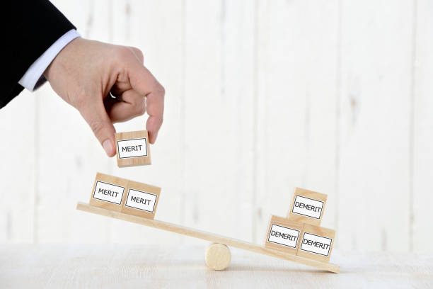 istock Business man thinking about merit and demerit 1138104593