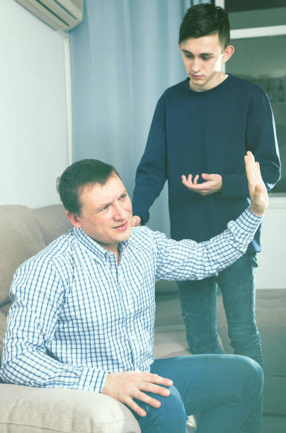 istock Guy is asking forgiveness from his father after conflict 1138106460