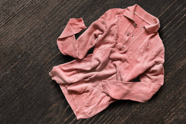 istock Shirt on wooden background 1138107522