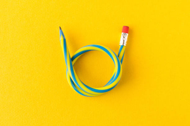 istock Flexible pencil . Isolated on yellow background. Bending pencil. 1138107530