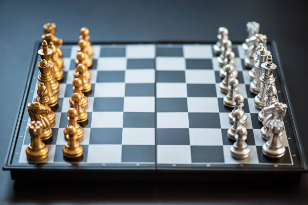 istock Close-Up Of Chess Board On Black Background 1138108117