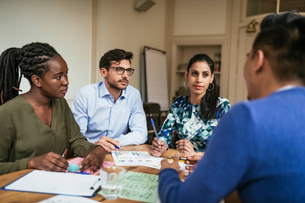 istock Multi-ethnic millennial business team - striving to creative ideas 1138109886