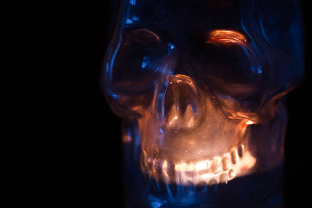 cadle in a shape of a skull. black background