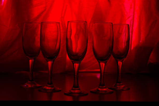 glasses of champagne on red background. party concept