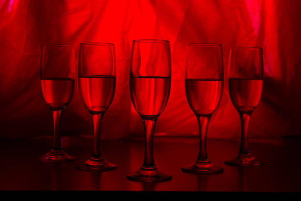glasses of champagne on red background. party concept