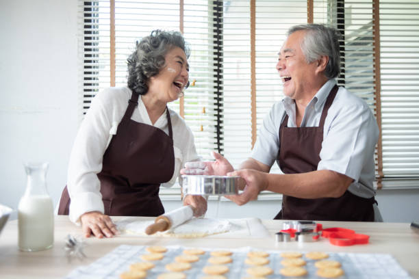 istock senior couple baking cookies. 1138117796