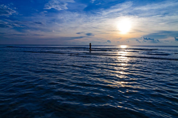 istock Woman twilight exercise on beach at Ban Krut Beach 1138119634