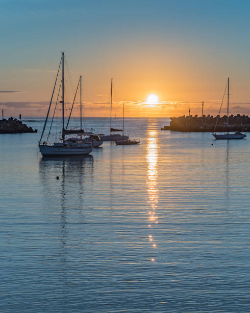 Sunrise and boats in the harbour Taken at Ulladulla Harbour on the South Coast of NSW, Australia. shoalhaven stock pictures, royalty-free photos & images
