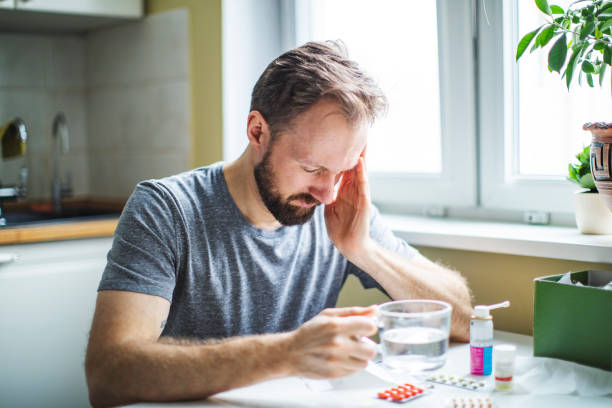 istock Young adult man with cold , flu, running nose 1138124112