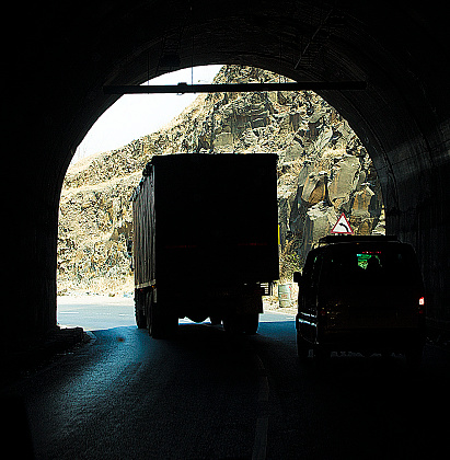 A couple enjoying a drive through a tunnel.