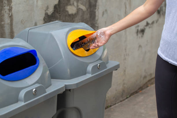 istock Close up woman hand throwing empty plastic bottle drop in recycling bin , Save the world concept 1138125971