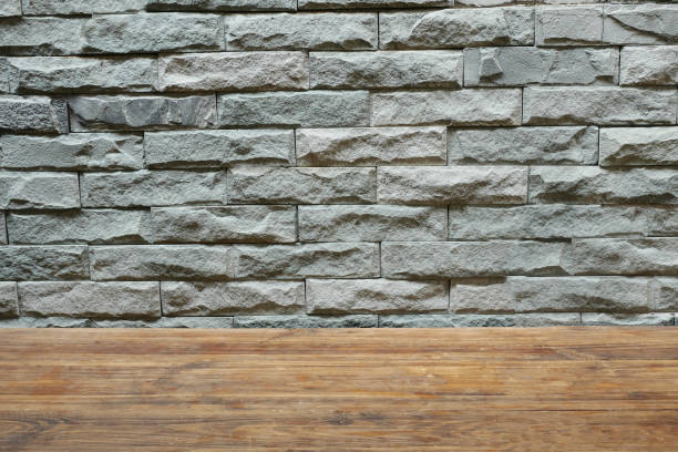 istock Gray block wall and wooden table 1138127330