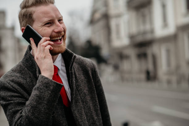 istock Young businessman using mobile phone on the street 1138129941