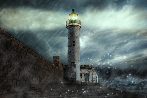 Lighthouse on a stormy night on the coast of Propriano Corsica