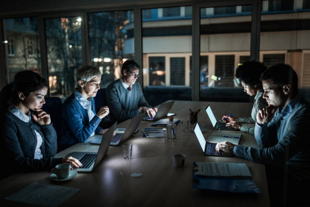 istock Business people working late on computers in the office. 1138131414