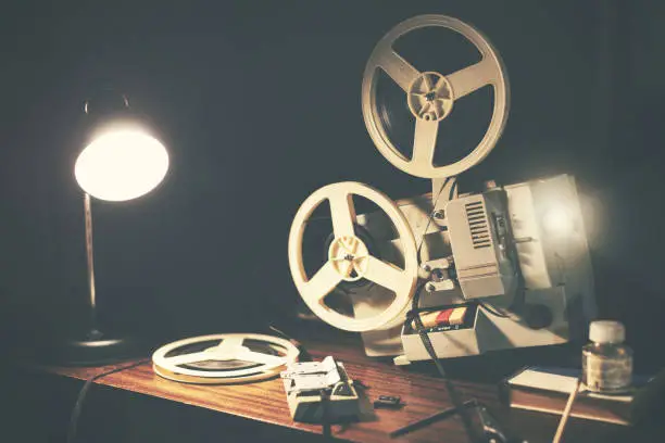 Photo of retro 8mm movie projector on the table