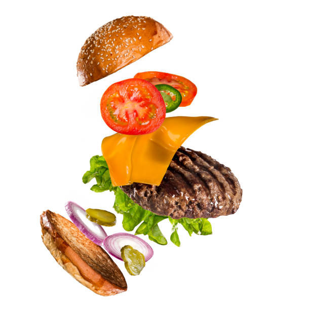 istock Tasty hamburger with flying ingredients on white background 1138134644
