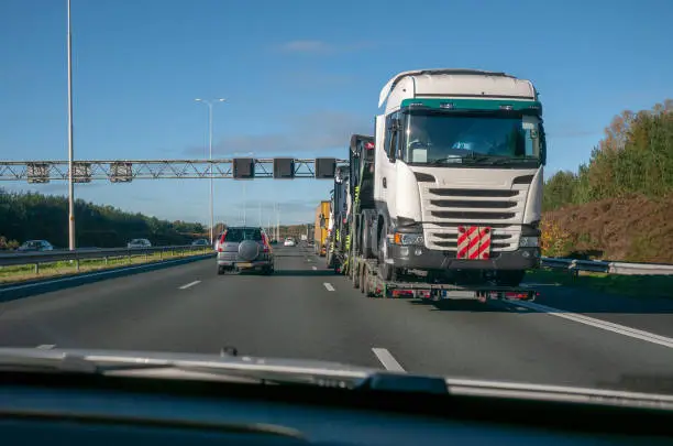 illusion of Wrong-way driving on European highway which is in fact a truck on trailer