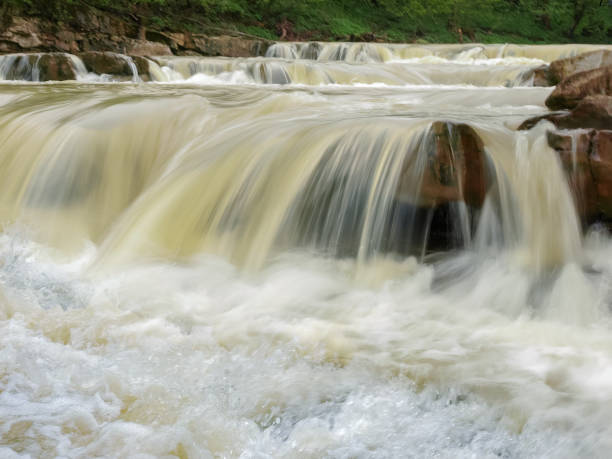 istock Multi-level waterfall on mountain river after rains close-up, Carpathians 1138136524