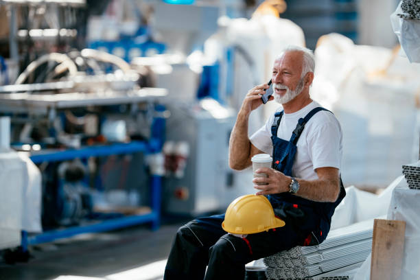 istock Senior factory worker having coffee break 1138137547