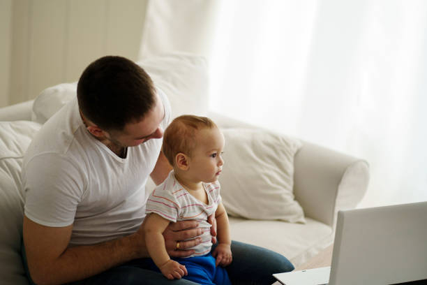 istock Father and son watching video or playing game 1138137638
