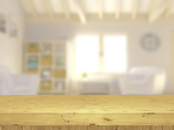 istock 3D wooden table looking out to a defocussed lounge interior 1138138262