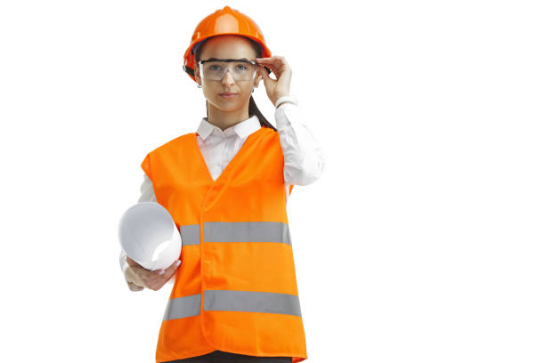 istock The female builder in orange helmet isolated on white 1138142405