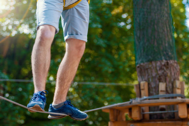 istock Young man enjoy active leisure in extreme rope park 1138142687